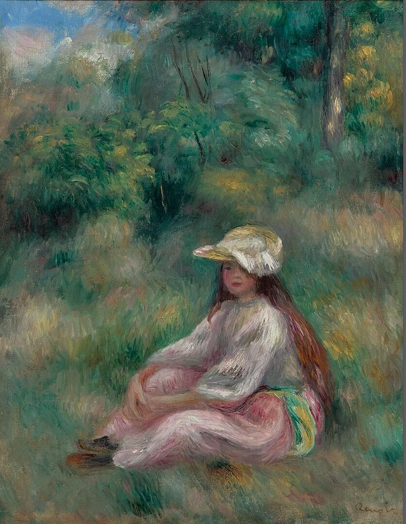 Jeune fille en rose dans un paysage
