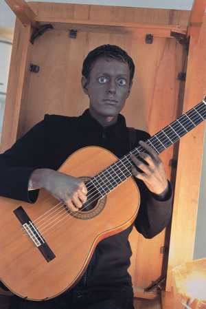 self-portrait-with-black-face-and-guitar