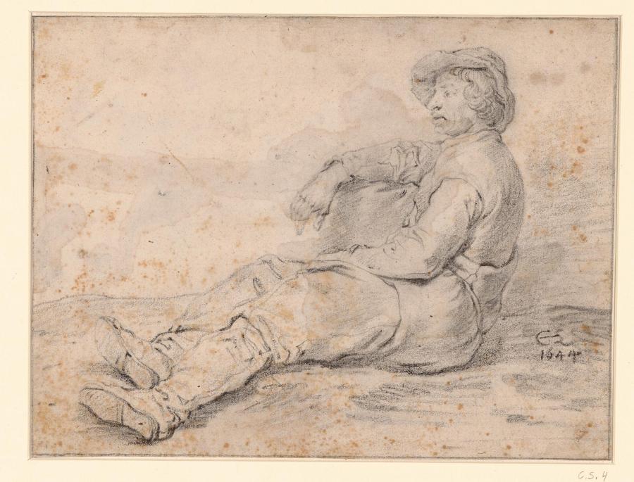 Een man ligt op de grond