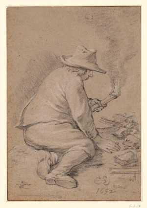 a-man-sits-on-the-ground-with-a-torch-in-his-hand