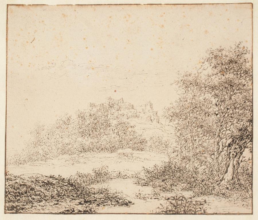 Duinlandschap met een stad in het verschiet