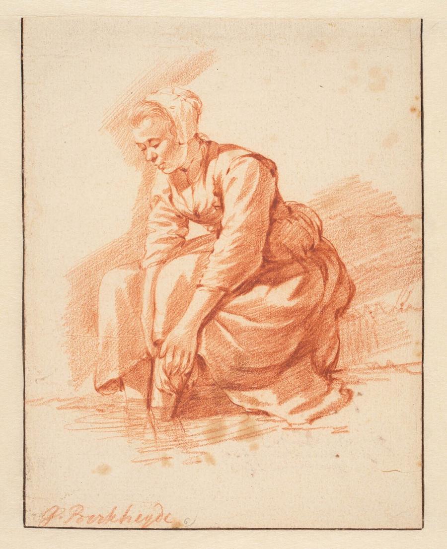 Een vrouw die haar voeten wast in een beek