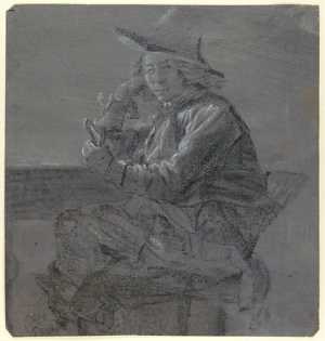 seated-man-leaning-on-a-table