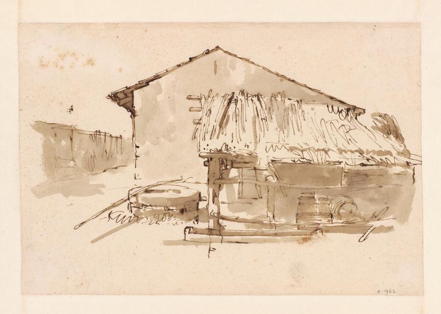 Zijkant van een boerderij met schuur en put