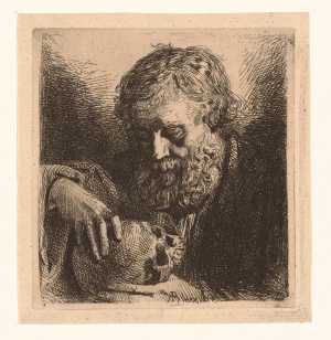 man-met-baard-houdt-een-schedel-vast