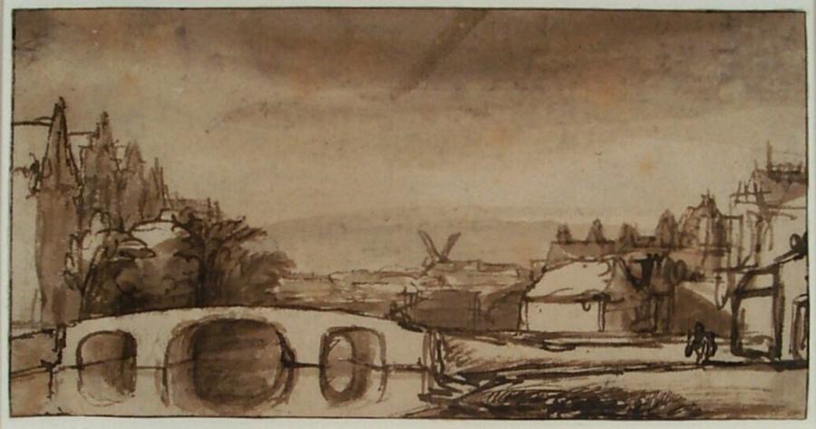 Gezicht op een stad met een stenen brug