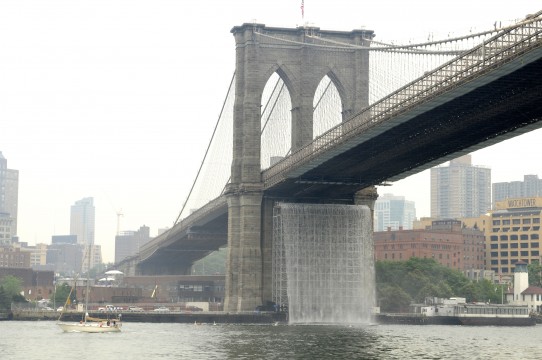 The New York City Waterfalls, 2008. Water, scaffolding, steel grill age and troughs, pumps, piping, intake filter pool frames and filter fabric. LED lights, ultra-violet filters, concrete, switch gears, electrical equipment and wiring, control modules, and anemometres. Brooklyn Bridge, New York, 2008. Photo: Julienne Schaer / Courtesy Public Art Fund